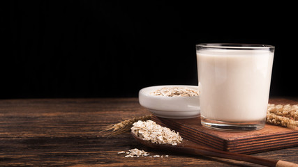 A glass of oat milk and cereal oatmeal