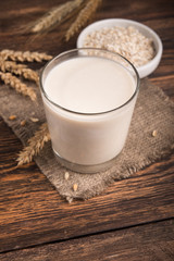 A glass of oat milk and cereal oatmeal