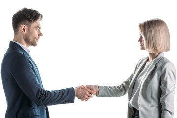 pretty businesswoman and handsome businessman shaking hands and looking at each other isolated on white