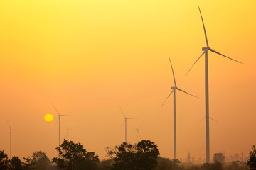 wind turbines at sunrise time.