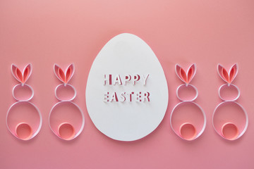 Happy easter. Easter egg made of paper on pink background.