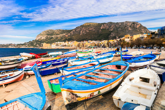 Traditional fishing village Aspra Sicily Italy colorful boats in harbor crystal clear Mediterranean sea panoramic coastal landscape historic seaside village