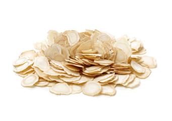 Chinese Herbal medicine - American Ginseng slices (Panax quinquefolius) isolated on white background © zcy