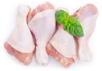 Raw chicken legs on white background