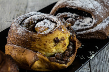 sweet buns on a rough wooden background