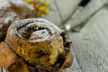 sweet buns on a rough wooden background