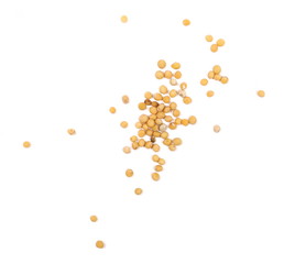 Yellow mustard seeds macro isolated on white, top view