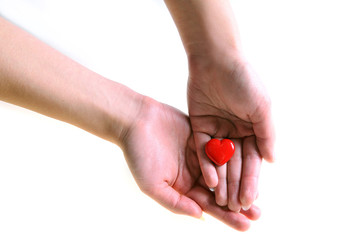 Heart in our hands. The image of the heart in the hands. Healthy lifestyle. Health care. Close-up
