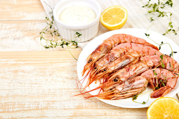 Grilled big tiger shrimps prawns on white plate