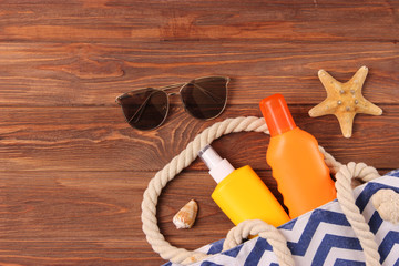  seashells and sunscreen on a colored background top view. Sunscreen