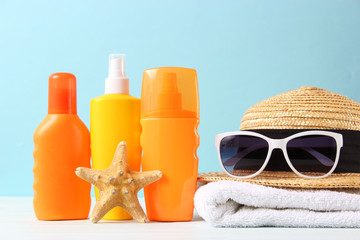 Set of different sun creams on a colored background. Cosmetics for sun protection.