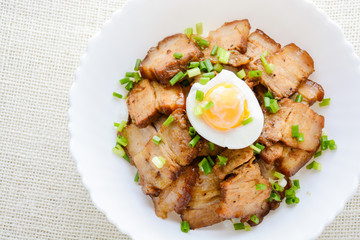 Bowl of rice topped with Braised pork belly and boiled egg, Japanese called Kakuni-don.