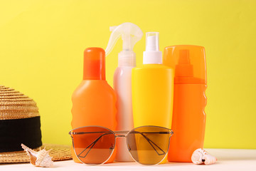 Set of different sun creams on a colored background. Cosmetics for sun protection.