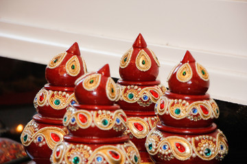 decorative kalash with coconut and leaf with floral decoration