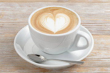 Cup of coffee art closeup