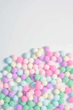 Sweet pastel color pom pom background with space