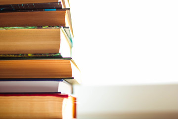 Books stack on white background. Blurred book concept. Educational background.