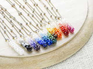 Obraz na płótnie Canvas Pendant crystals and diamonds. Gemstone crystal pendant, silver color, various colors..
