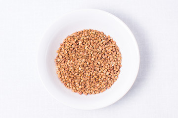 buckwheat in a bowl isolated on white
