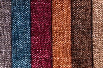 A set of samples of fabric furniture decoration lines of textile textures. Multicolored stripes upholstery. Mode and tone for a luxurious interior style. Abstract background