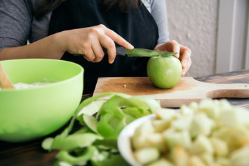 Woman cutting apples. Close Up