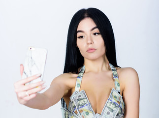 money girl in erotic lingerie making selfie. investment in yourself. business success. dollar...