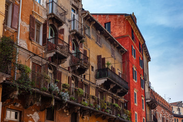 Fototapeta na wymiar Verona, Italy – March 2019. Historic town square Elbe with stairs surrounded by cafes and buildings of peculiar architecture, Verona, Italy