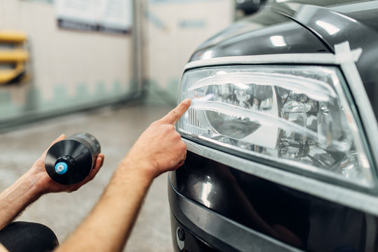 Detailing Of Headlight, Man Smears Polishing Paste