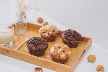 Breakfast with fresh homemade delicious muffins and milk.