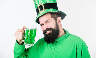 For good luck. Bearded man toasting to saint patricks day. Hipster in leprechaun hat holding beer...