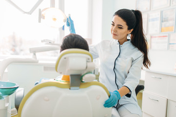 Boy in a dental cabinet, pediatric dentistry