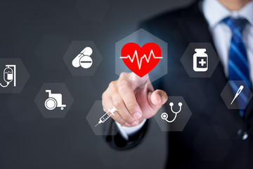 Health insurance concept, Businessman press the healthcare medical icon