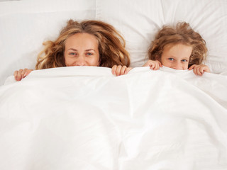Mother with child in bed