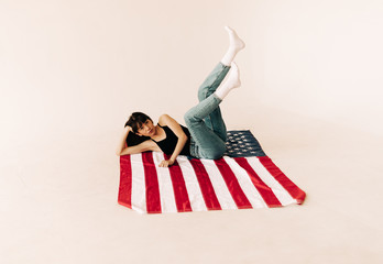 Young woman on the american flag