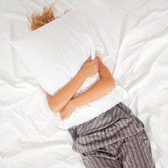 Obraz na płótnie Canvas Tired woman on the bed