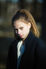 Portrait of cute young girl outdoors.