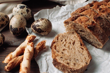 pieces of bread, quail eggs on the table top view