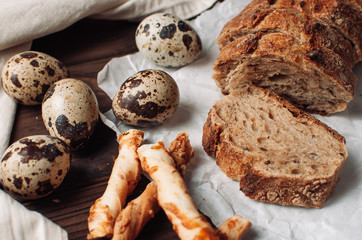 pieces of bread, quail eggs on the table