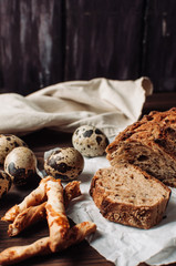 Homemade baguette loaves on rustic wood