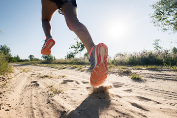 Sport running man in cross country trail run