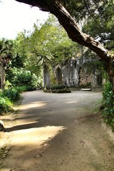 Ancient stone ruins in a leafy garden of Sintra