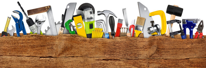 DIY handtools collage concept behind wooden wide panorama plank with copy space isolated white background