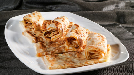 Slices of thin dough stuffed with pumpkin