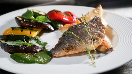 Fototapeta na wymiar Fried fish with vegetables