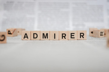 Admirer Word Written In Wooden Cube - Newspaper