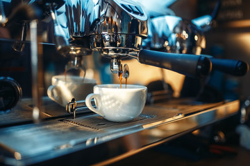 Espresso machine pours fresh black coffee closeup - obrazy, fototapety, plakaty