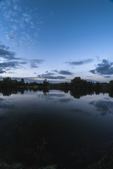 Evening summer landscape on the pond