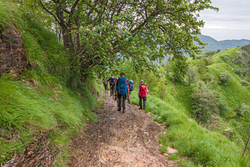 Some hikers walk the steep paths of the Apuan Alps in Italy.
