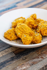 Chicken Wings Spicy chicken wings, breaded, fried, cooked.
