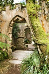 Ancient stone ruins in a leafy garden of Sintra